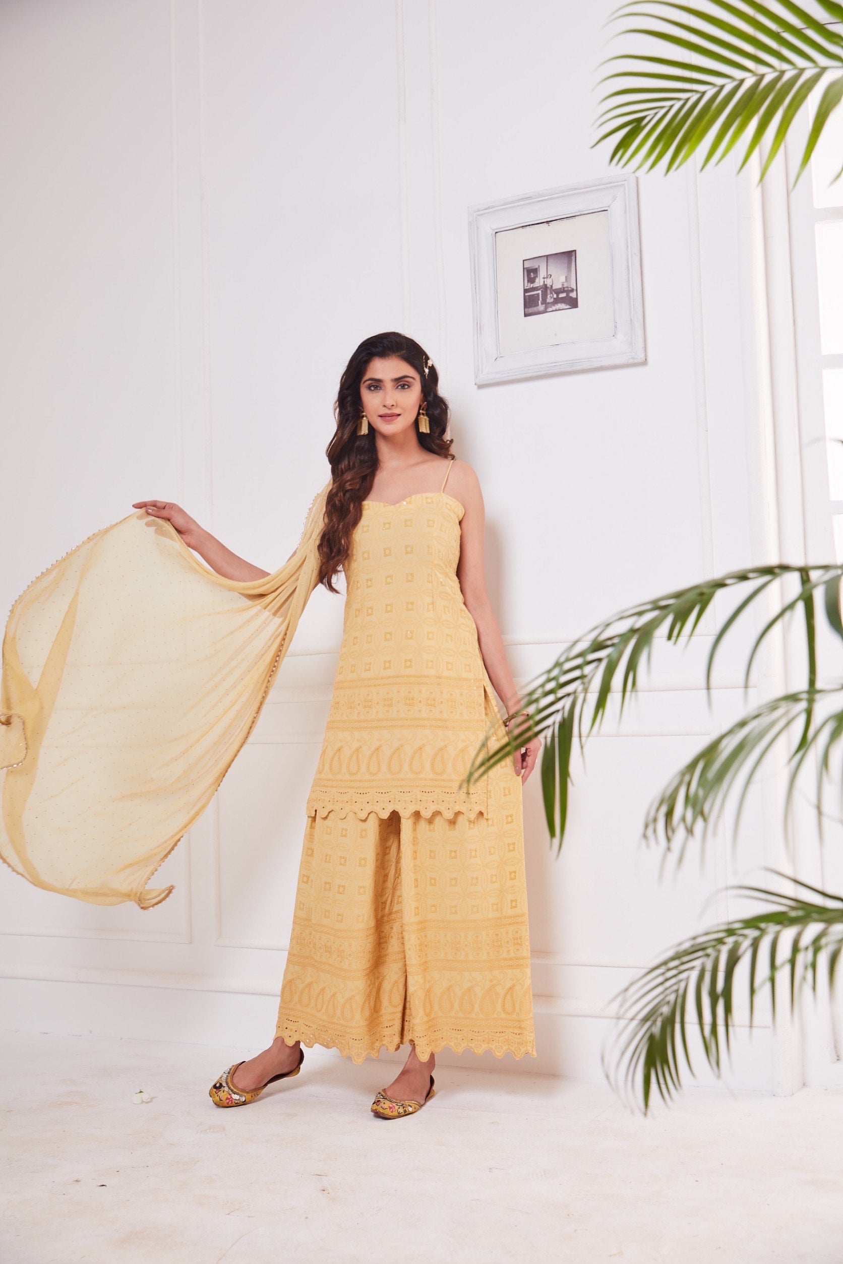 Nikita Sharma's rayon schiffly sequin work embellished Beige Gharara set & Dupatta