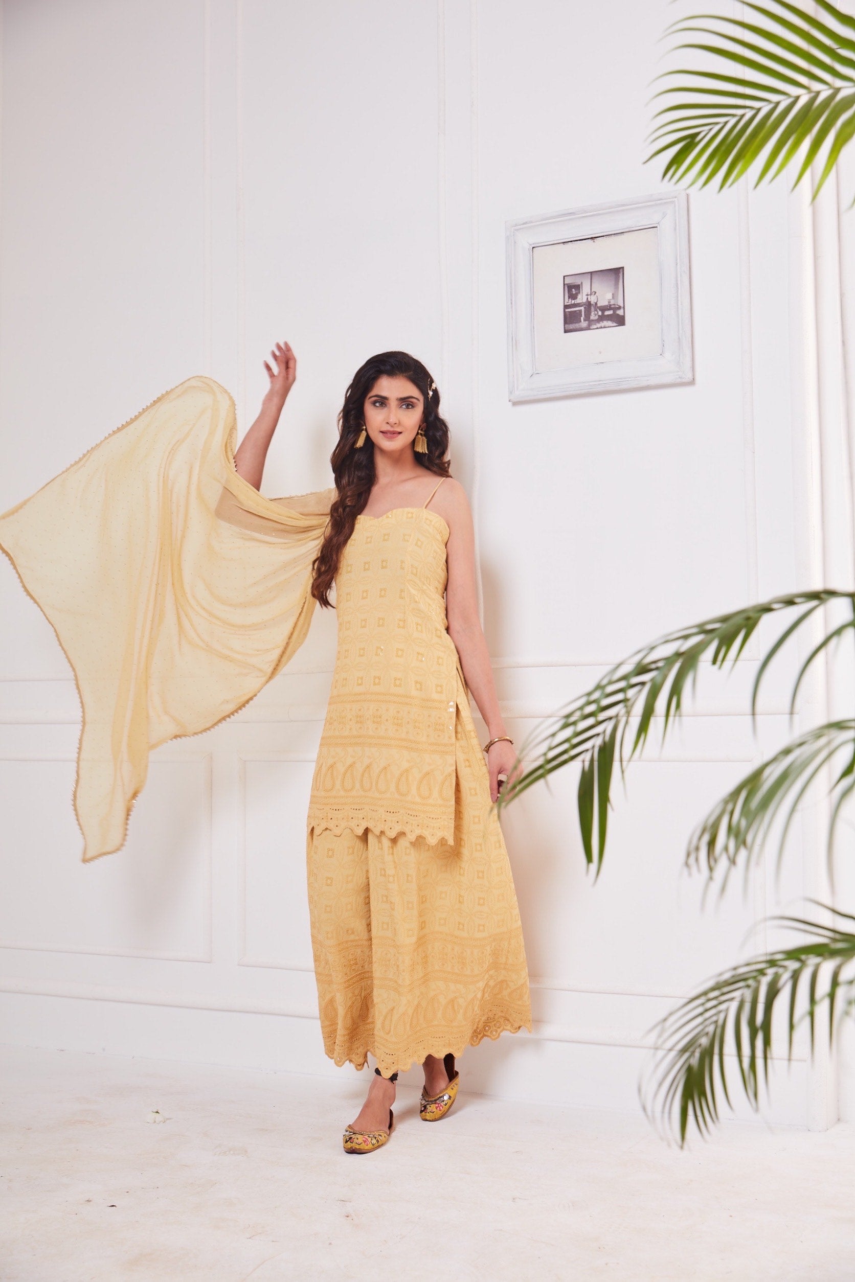 Nikita Sharma's rayon schiffly sequin work embellished Beige Gharara set & Dupatta