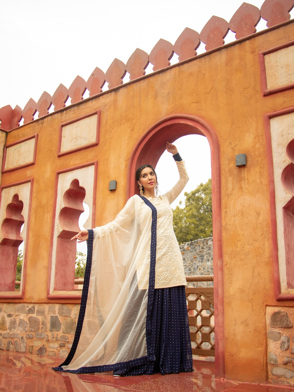Be elegant and glamorous in this 3-piece formal set, crafted with exquisite chikankari and viscose georgette fabric with a traditional kajol inspired style. Lined with crepe fabric all over, this ivory Indo-Western look by Saadgi. chicken, chikan kurti, chikan suit, chikankari kurta for women, chikankari kurta, chikankari kurta set, chikankari short kurti, chikankari suit set, gharara, chikankari suits, hand crafted, lakhnavi kurti, lucknowi chikankari kurti, lucknowi kurti, lucknowi