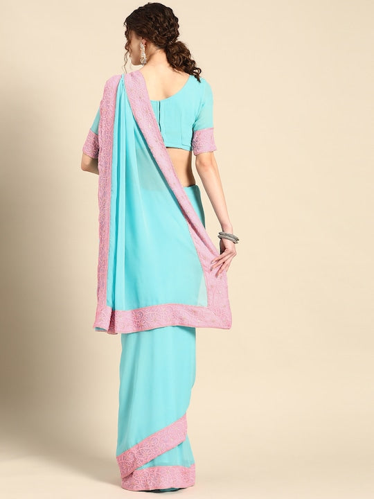 This Saadgi Chikankari Bordered Pink & Blue Viscose Georgette Saree is designed with a machine chikankari border with gold zari work and a contrast lively color. It's perfect for both formal wear and family functions, and comes with an unstitched blouse. Crafted by the renowned Saadgi brand, this saree makes a perfect statement for every occasion. party wear sarees, organza sarees, chicken, chickenkari, chicken saree, lucknowi chikankari saree, saree